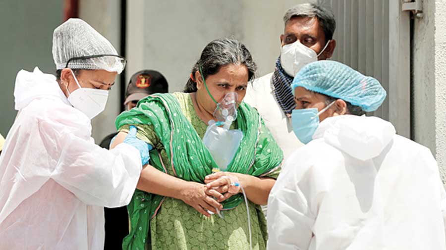 A stable patient at Government Civil Hospital, Ahmedabad, is moved to another hospital to make space for critical  Covid-19 patients on April 18. 