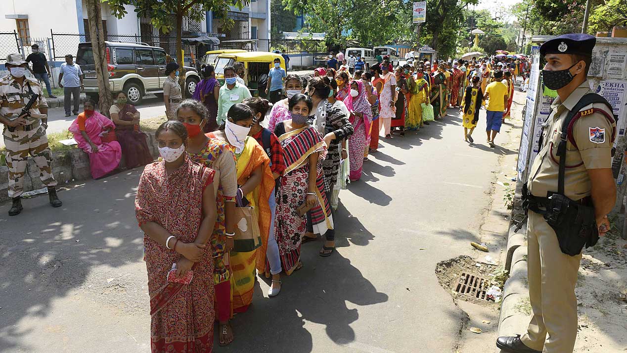 Voters queue up outside Bharatiya Vidya Bhavan