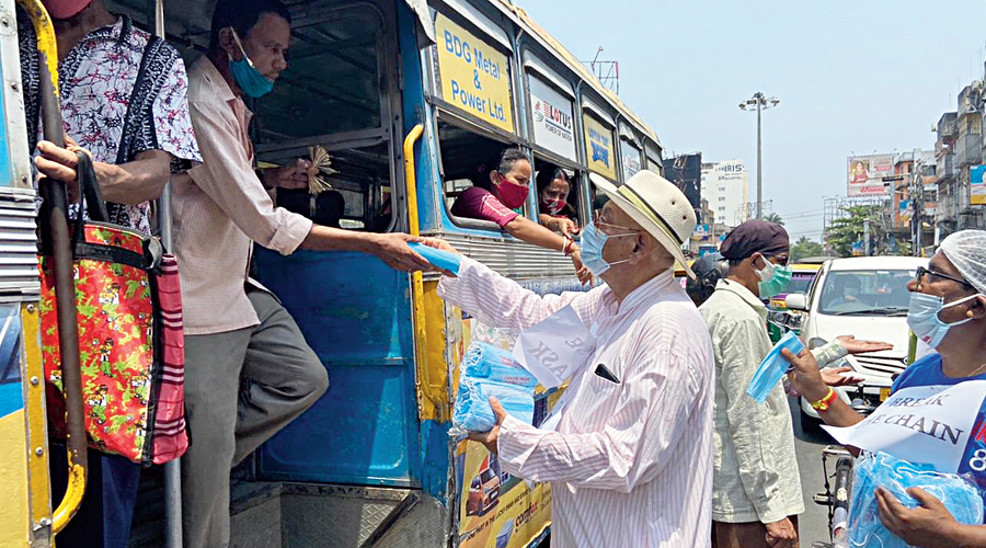 Once ostracised, 74-year-old now distributes masks, sanitisers and chocolates- he was infected by the coronavirus last year 