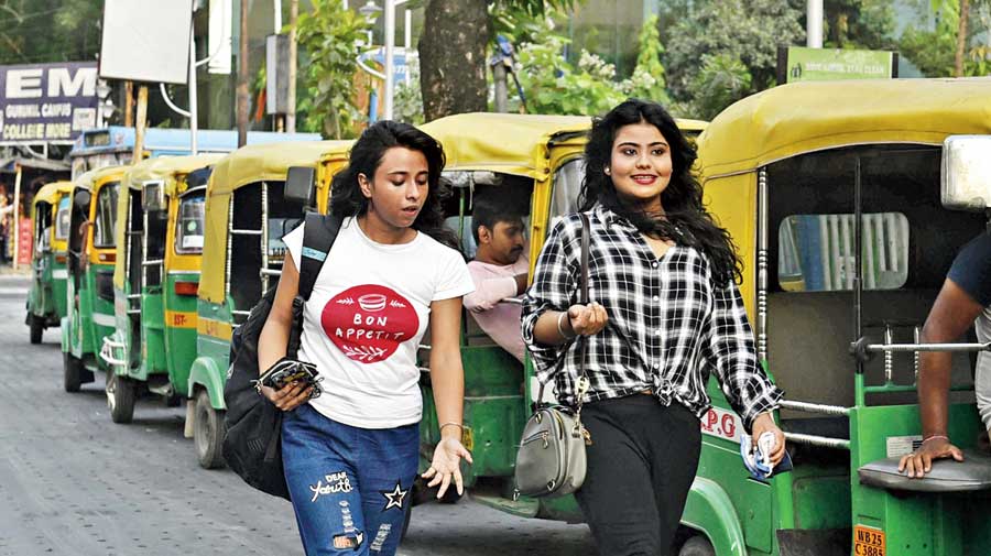 Two college-goers were spotted walking down a road near IEM College in Sector V without masks.