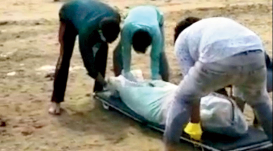 Muslim friends help in last rites of the mother of the Hindu youth at Palamau on Friday.