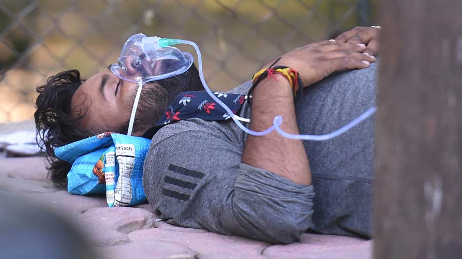 A Covid patient receives free oxygen, provided by a Sikh organization at Indirapuram Gurudwara in Ghaziabad on Saturday.