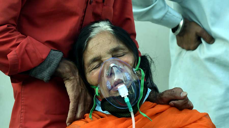 A Covid patient receives free oxygen, provided by a Sikh organization at Indirapuram Gurudwara in Ghaziabad on Saturday.