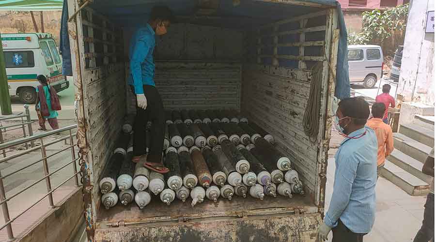 Oxygen cylinders being unloaded at the Sadar Hospital in Ranchi.