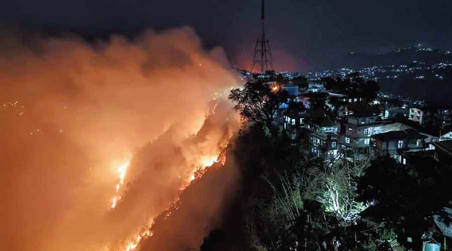 The massive forest fire below the Chanmari area of Lunglei town on Saturday night.