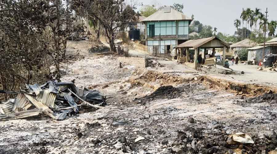 The remains of houses razed in Bungtlang S in Lawngtlai on Monday.