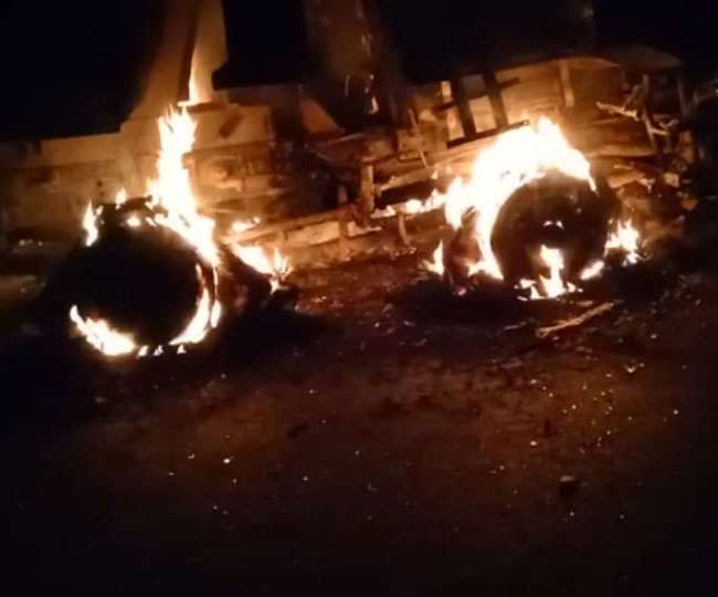 One of the trucks damaged by extremists burns on the Mandar-Laranga Road in Tandwa on Monday night.