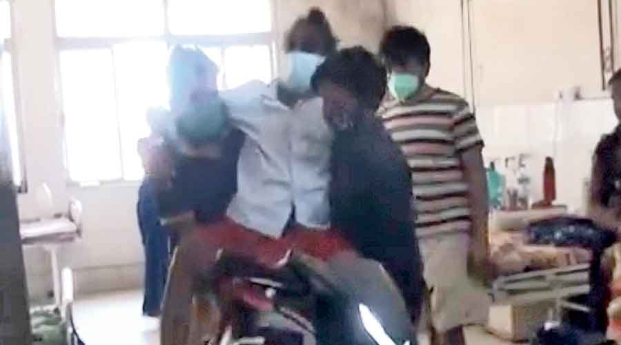 Scooter ride from ICU for Covid test- medical centre in Jharkhand has run out of even stretchers