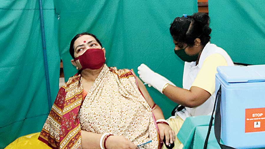 A woman gets vaccinated  in Burdwan. 