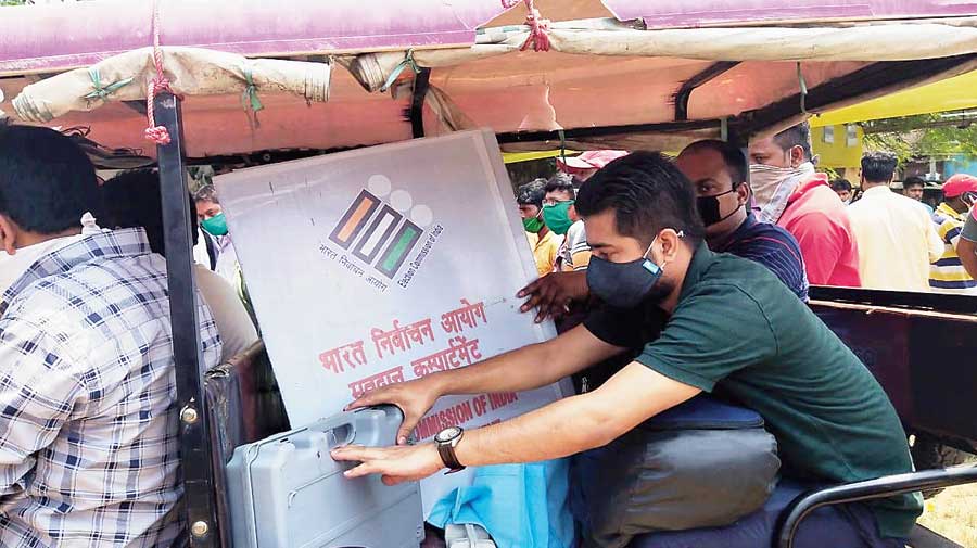 Polling personnel leave Malda Polytechnic for booths  on Wednesday. 