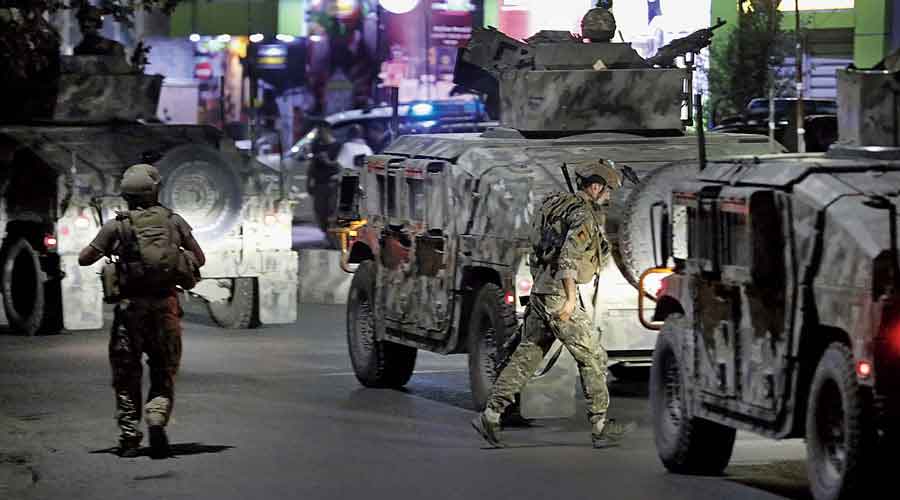 Afghan security personnel at the scene of the powerful explosion in Kabul on Tuesday.