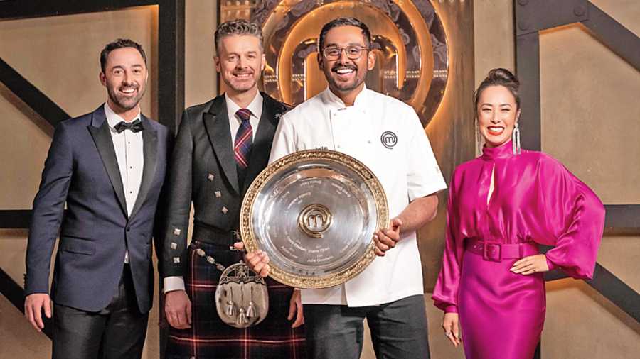 Justin Narayan with the MasterChef Australia trophy, flanked by judges (L-R) Andy Allen, Jock Zonfrillo and Melissa Leong  