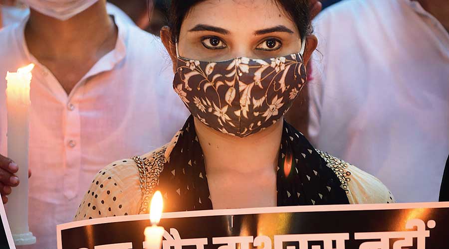 An Indian Youth Congress activist at a candlelight march in New Delhi on Wednesday to demand justice for the girl.