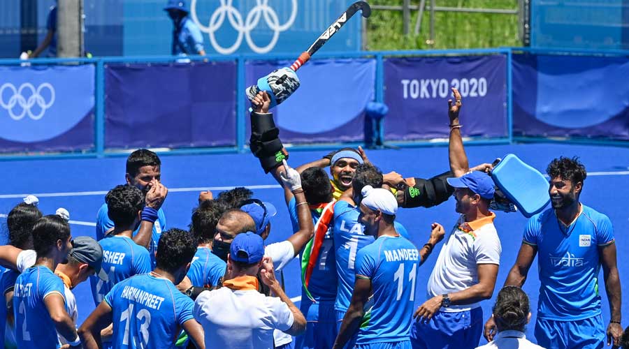 Indian players celebrate their victory over Germany in the mens field hockey bronze medal match, at the 2020 Summer Olympics in Tokyo.