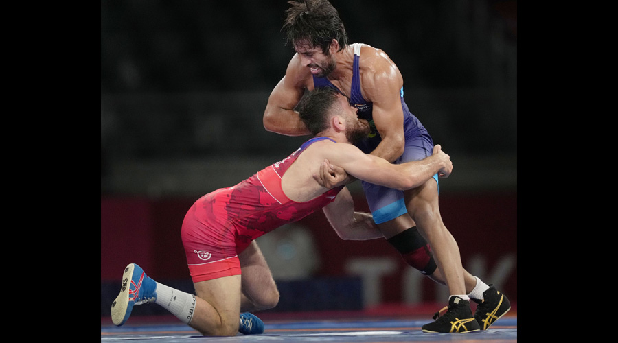 Bajrang Punia (right) during the 65kg semi-final bout against Haji Aliyev on Friday. 