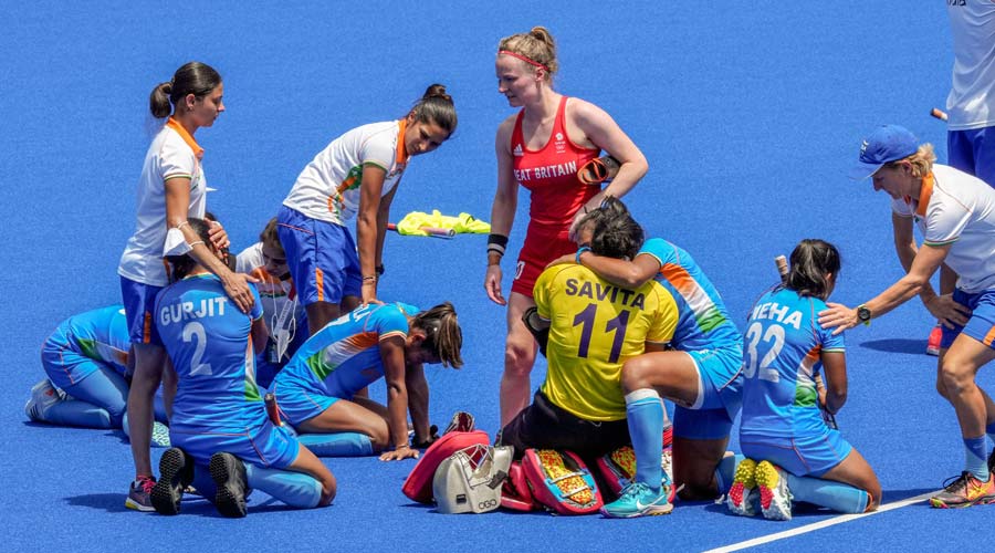 Indian players react after losing their women’s field hockey bronze medal match against Great Britain, at the 2020 Summer Olympics, in Tokyo.