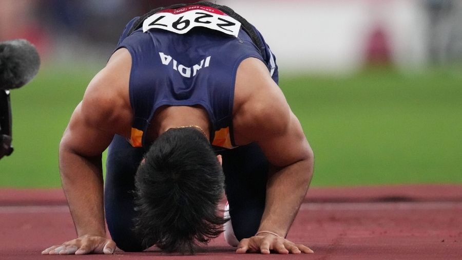 Neeraj Chopra bows down on the track after winning India's first Gold at the Tokyo Olympics on Saturday.