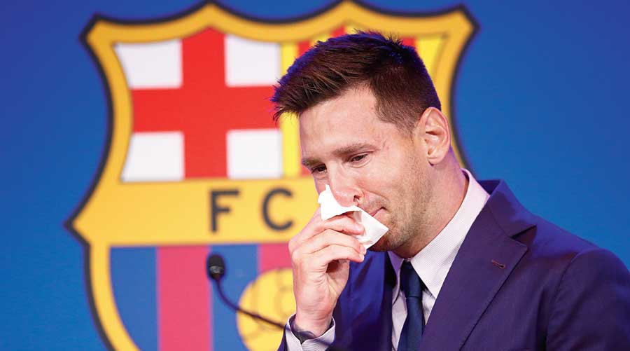 One last time: Lionel Messi breaks down before the news conference  at Camp Nou on Sunday.