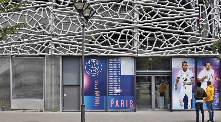 Paris Saint-Germain supporters stand outside an annexe of the Parc des Princes stadium in Paris on Monday. Lionel Messi could become the latest star to help PSG in their quest to win the elusive Champions League. 