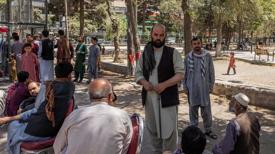 Internally displaced Afghan families fled from Kunduz and Takhar province due to battles between Taliban and Afghan security forces, collect food in Kabul on Agust 9, 2021. 