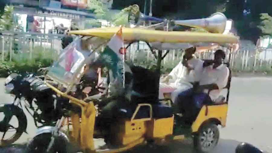Trinamul workers roam around at Raghunathpur in an erickshaw on Monday. 