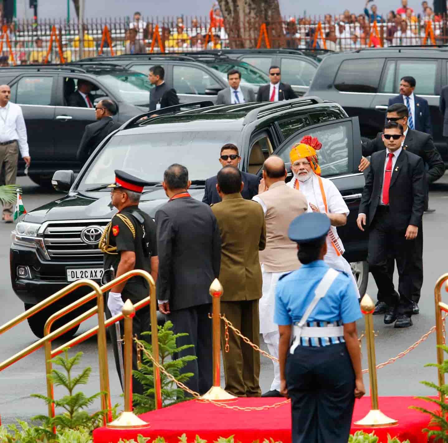 Rajnath Singh greets Narendra Modi as he arrives at the Red Fort on Sunday.