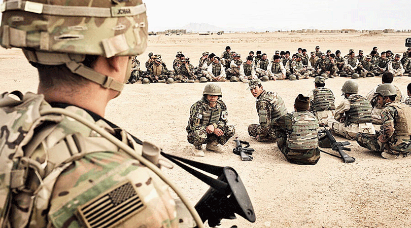 An American soldier oversees training of his Afghan counterparts in Helmand Province  in 2016. 
