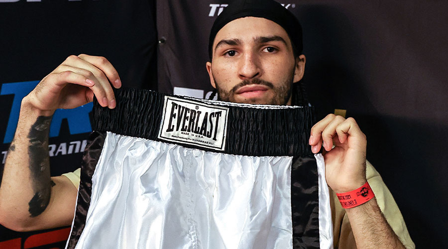 Nico Ali Walsh with the trunks made for his grandfather Muhammad Ali. 