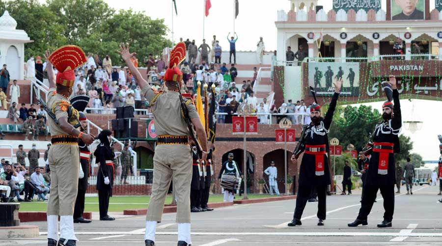 Border Security Force personnel and Pakistani Rangers during the Beating Retreat border ceremony on the occasion of 75th Independence Day, at the Attari-Wagha border