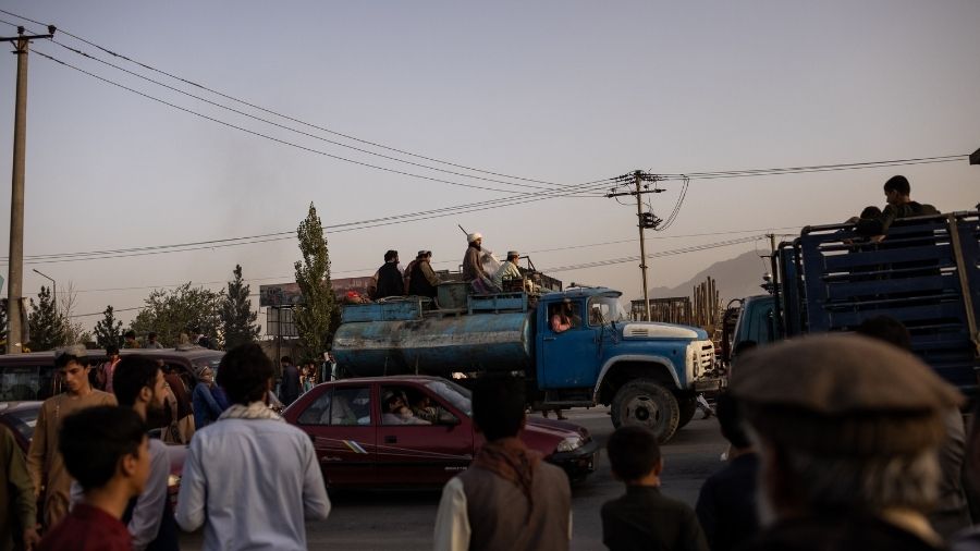 Taliban fighters on a Humvee in Kabul on Tuesday.
