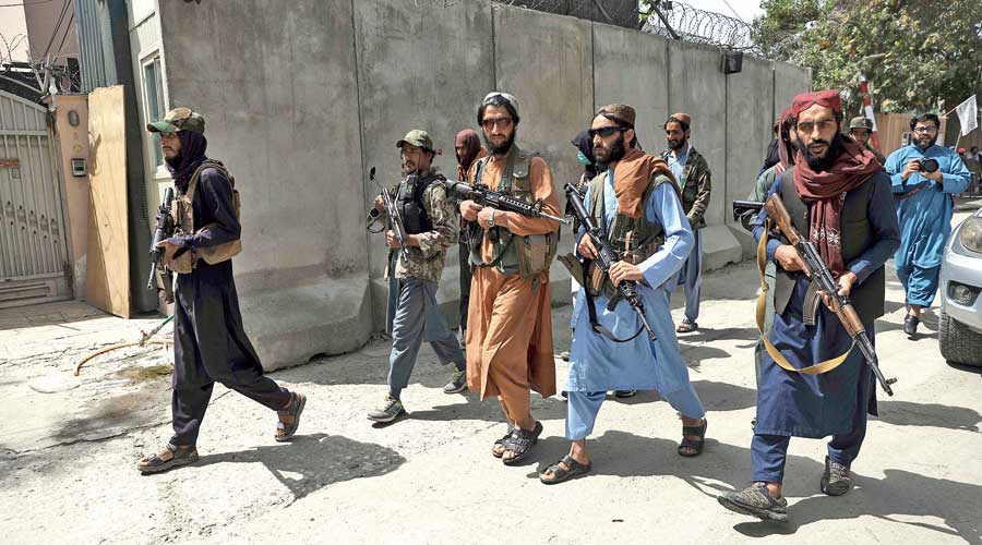 Taliban fighters patrol the Wazir Akbar Khan neighbourhood in Kabul on Wednesday.