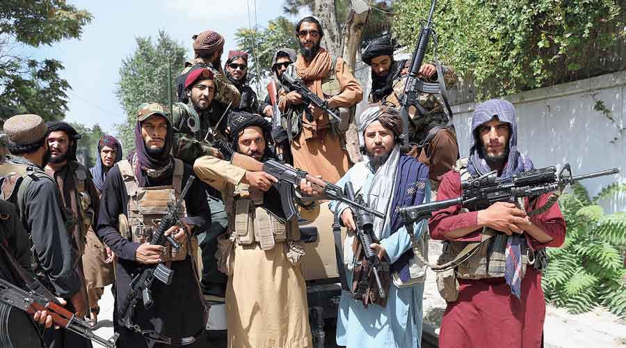 Taliban fighters pose for a photograph in Kabul on Thursday while celebrating Afghanistan’s independence day.