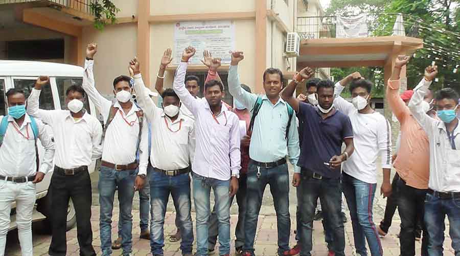 Covid-19 testing technicians of Dhanbad demonstrate in front of Dhanbad Civil Surgeon office on Wednesday.
