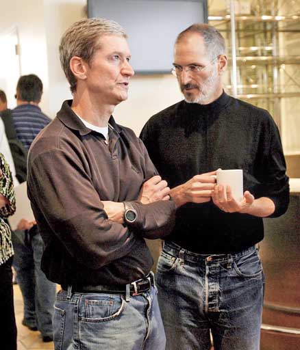 File picture of Tim Cook as the then chief operating officer with Steve Jobs