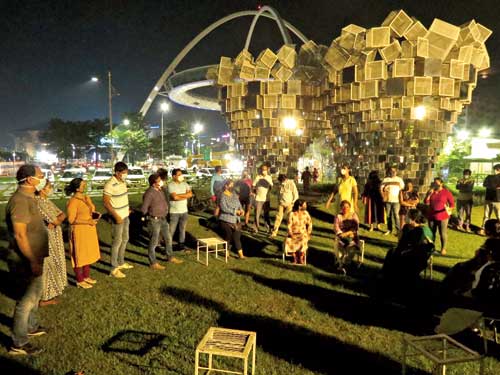 A residents’ meeting under way at Unbox Park on Monday evening. 