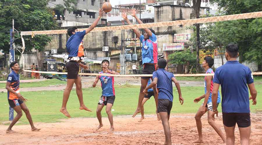 A Volleyball match in progress in between Dhanbad Red team and Dhanbad Blue team at Volleyball Ground, Jharnapara in Dhanbad on Sunday.