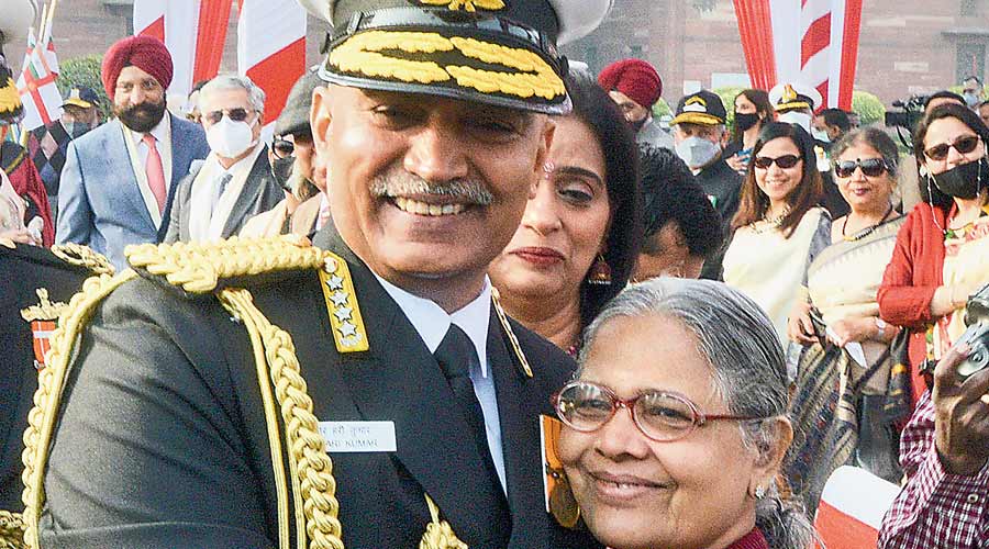 The newly appointed navy chief, Admiral R Hari Kumar, hugs his mother during the ceremony where he took charge in New Delhi on Tuesday. 