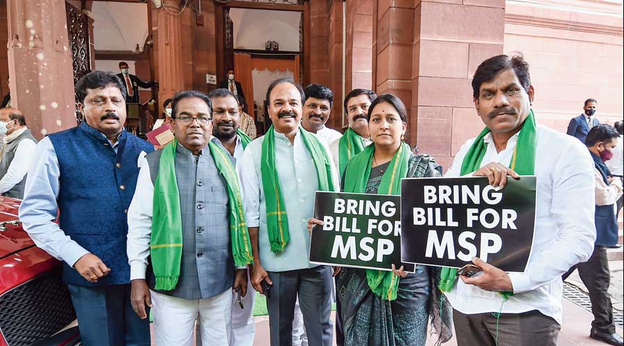 Telangana Rashtra Samithi MPs stage a protest outside Parliament on Tuesday to demand a bill guaranteeing  MSP to farmers.