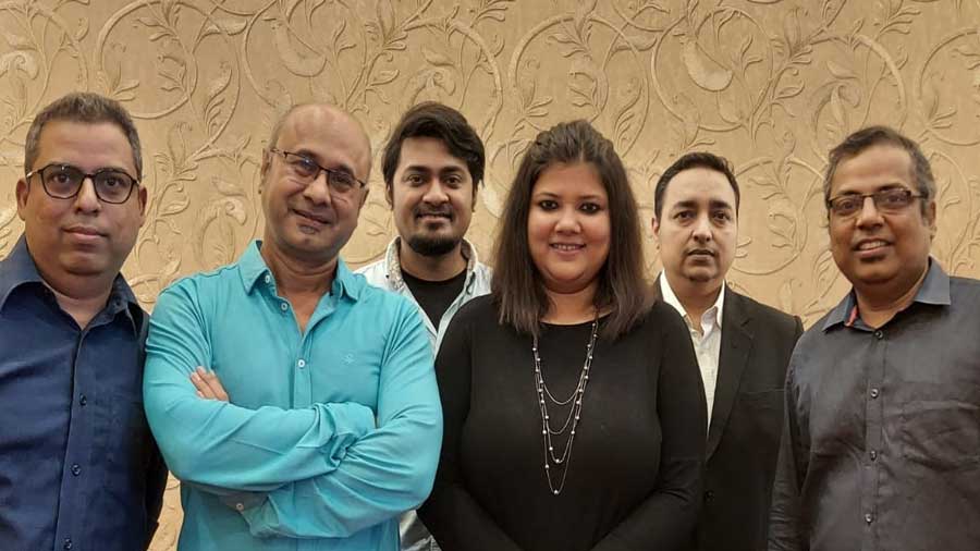 Crest is (L-R) Steven Rebeiro, Jeffrey Menezes, Sudipto Sarkar, Subhalakshmi Sen, Nigel Gomez and Stafford Rebeiro