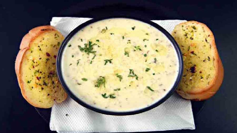 Cream of Mushroom Soup: Served with a side of crispy, toasted garlic bread, the soup is rich, velvety and herby. This savoury delight is a perfect start to a winter meal. Rs 200