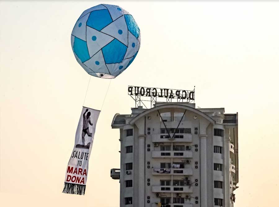 FLOATING TRIBUTE: A phanush marking the first death anniversary of the legendary football player Diego Maradona floats in the sky in Belgachia in north-east Kolkata on November 28, Sunday. Often dubbed as the greatest footballer of all time by his fans all over the world, Maradona died of a heart attack on November 25, 2020 weeks after undergoing a brain surgery