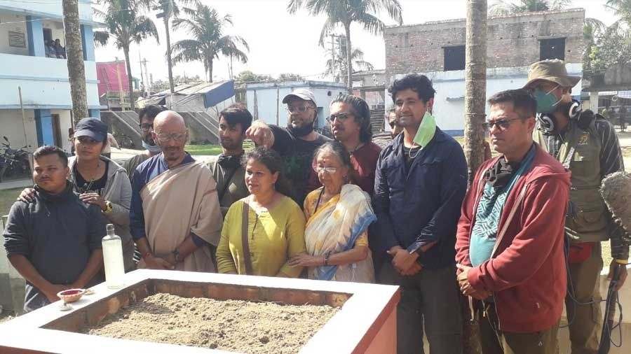 Moitra poses with his family and team members at the conclusion of the planting ceremony