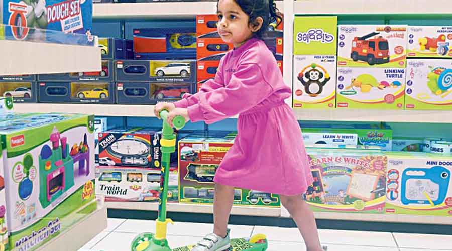 Three-year-old Naisha Bose was making the most of her play time at the store on a green LED scooter.  2,495 rupees.