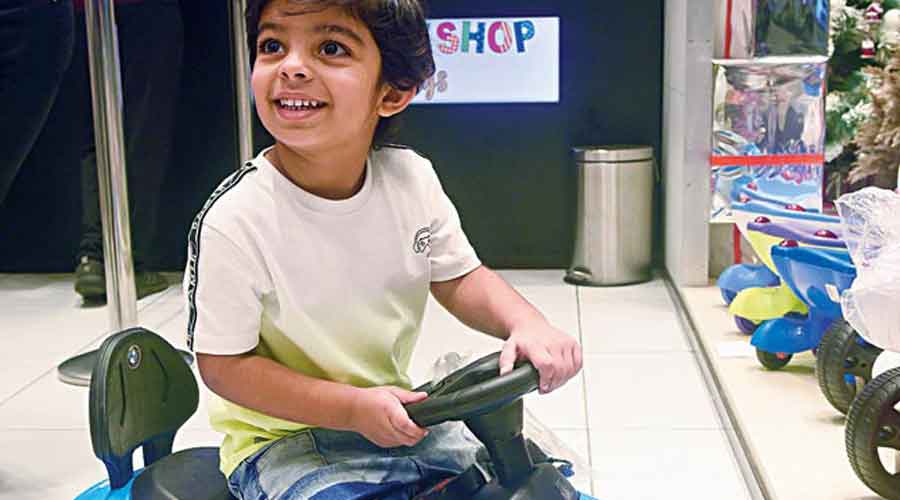 Ayaan Hasan, aged three-plus, was trying his hands at the wheels of a blue battery-operated four-wheeler with music. Rs 5,999.