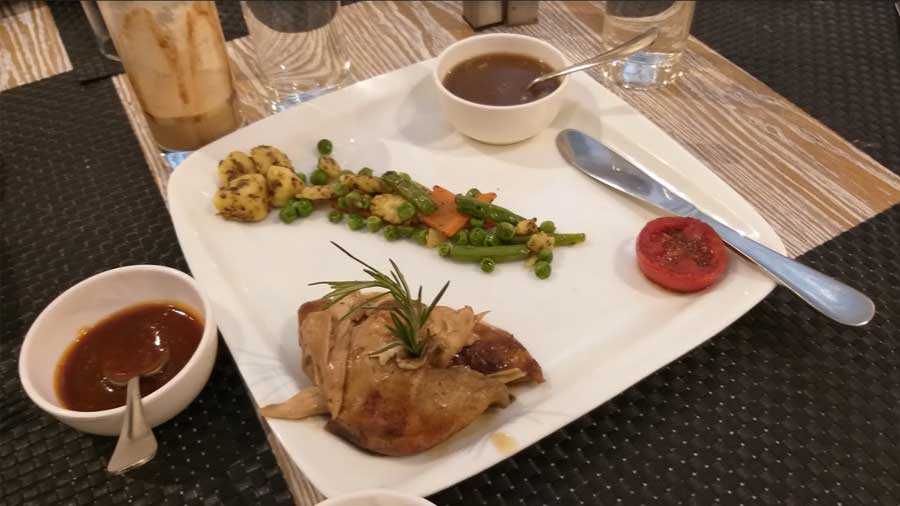 Grilled chicken with sauteed vegetables served at the restaurant