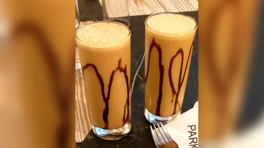 Cold coffee with chocolate sauce and ice cream