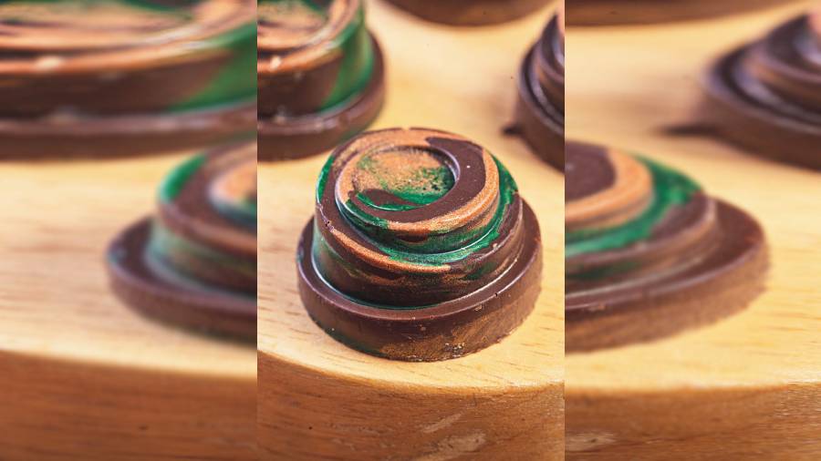 Yuzu Cheesecake Bonbon: These are tiny delights of cheesecake ganache and citrus yuzu — a Japanese orange-like fruit.