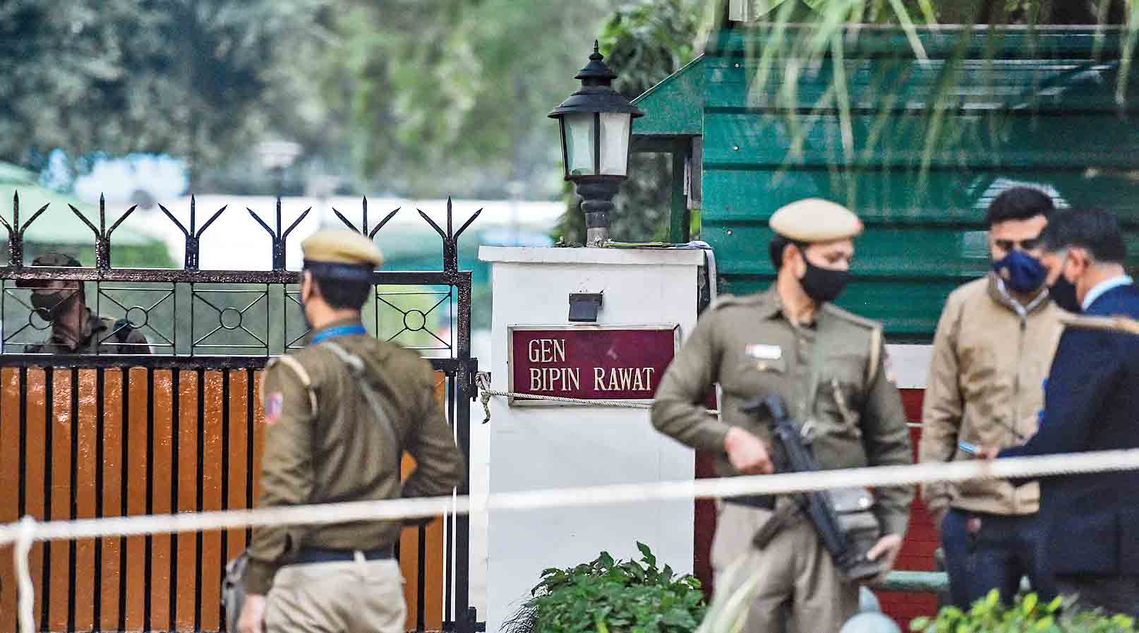 Security personnel outside the residence of Gen. Bipin Rawat in New Delhi  on Wednesday