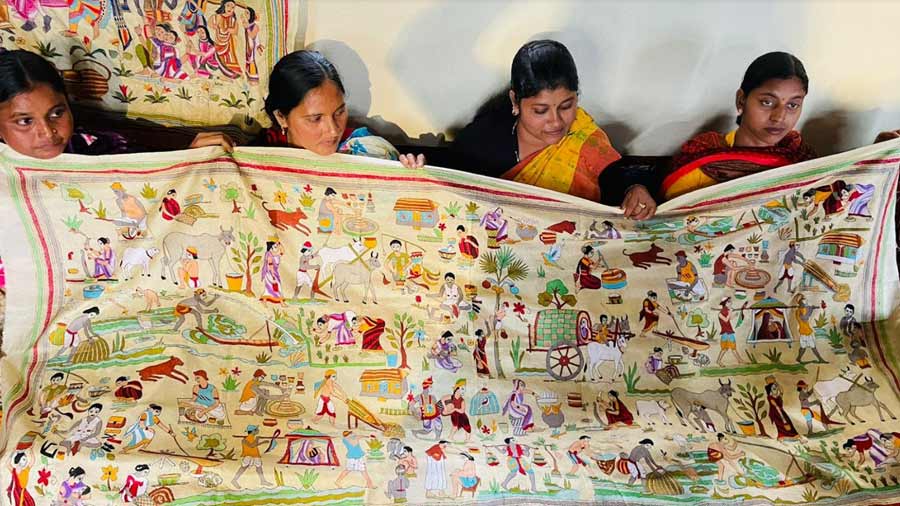 A dupatta with the traditional ‘kantha’ motifs of scenes from village life
