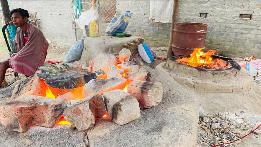 The community furnace in Dariyapur, used by craftsmen to melt metal and heat up the moulds, is almost always burning